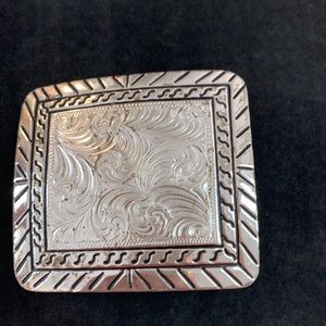 Silver belt buckle